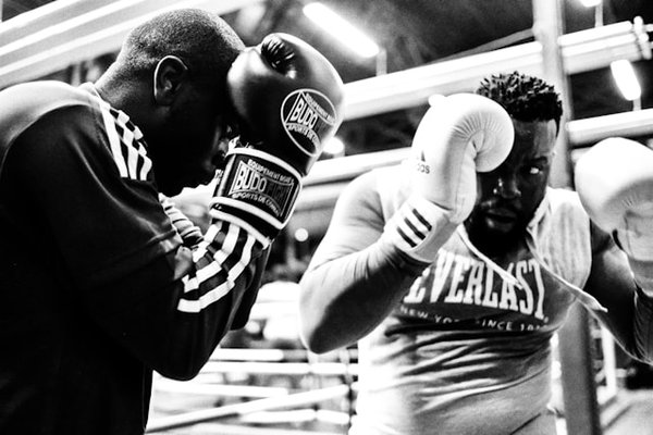 What are the best practices for integrating technology into combat sports training in the UK?